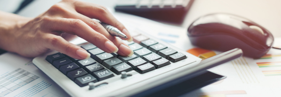 Hands using a calculator