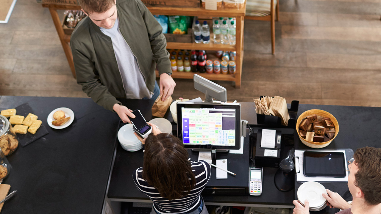 Customer at the store paying with a card